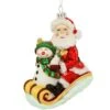 Santa With Snowman On Sled Glass Ornament